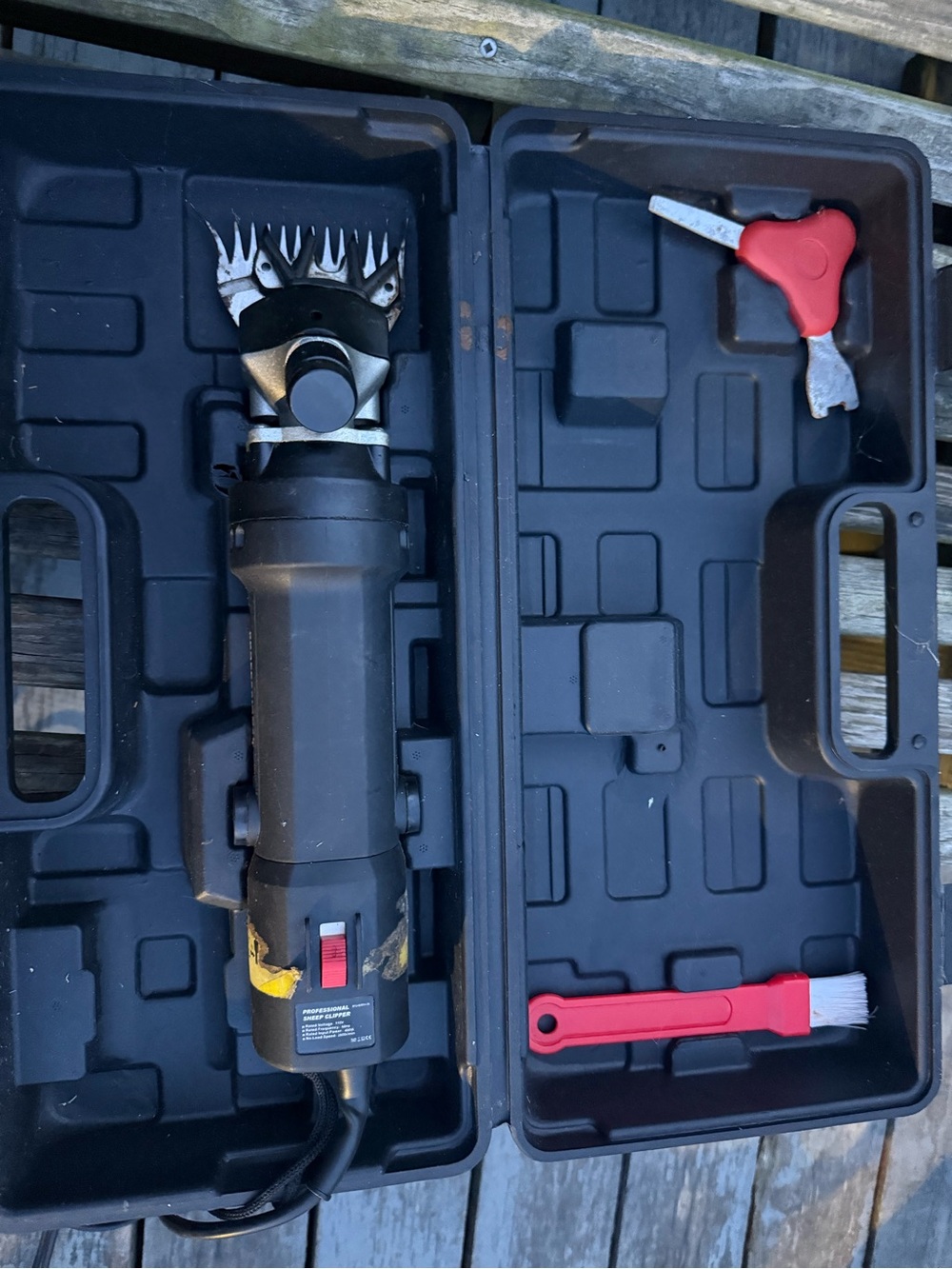Black Electric Livestock Shearer with Red Accessories